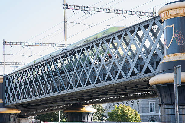 istock Lattice Girder Railway Bridge with Train; River Liffey; Dublin 518874793