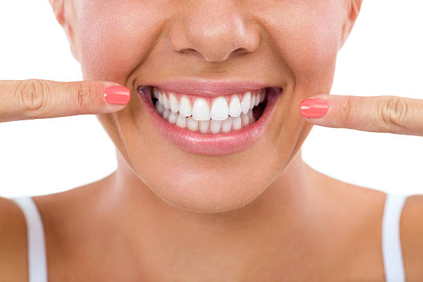 istock Woman showing her white teeth. 518878883