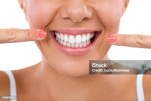 Woman Showing Her White Teeth Stock Photo - Download Image Now - Smiling, White Color, White People
