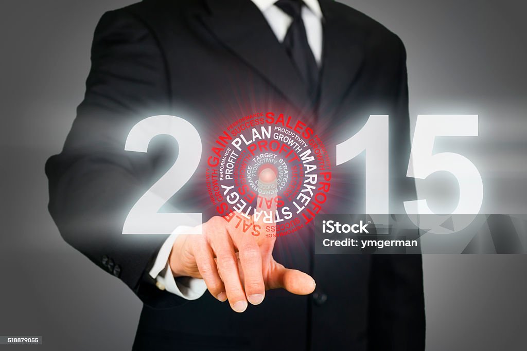 Businessman clicking on 2015 business target 2015 Stock Photo