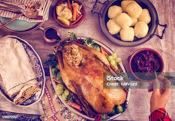 Traditional German Holiday Goose Dinner With Dumplings And Red Cabbage Stock Photo - Download Image Now