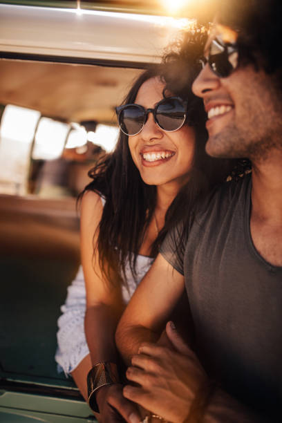 istock Mixed Race Hipster Friends Sitting Together at Sunset 518886314