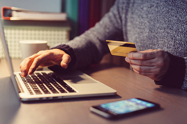 istock Man shopping online with credit card 518887092