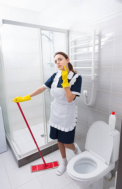 istock Pretty young housekeeper or maid 518889132
