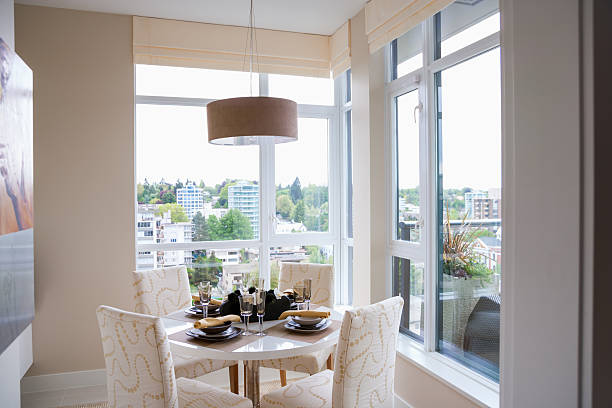 istock Breakfast nook surrounded by picture windows in condo 518889148