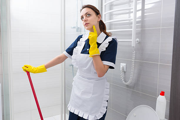 istock Thoughtful maid standing staring into the air 518889212