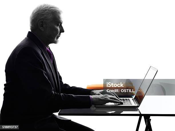 Senior Business Man Serious Computing Laptop Silhouette Stock Photo - Download Image Now