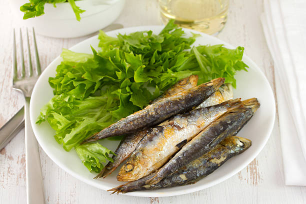 istock fried sardine with lettuce on the plate 518893973
