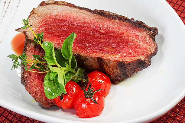 istock Medium Grilled bbq steaks and savory tomato sauce 518894479
