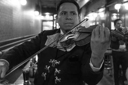 New York, USA - October 11, 2014: Violinist of a Mariachi group performing at a party at a restaurant in New York City.