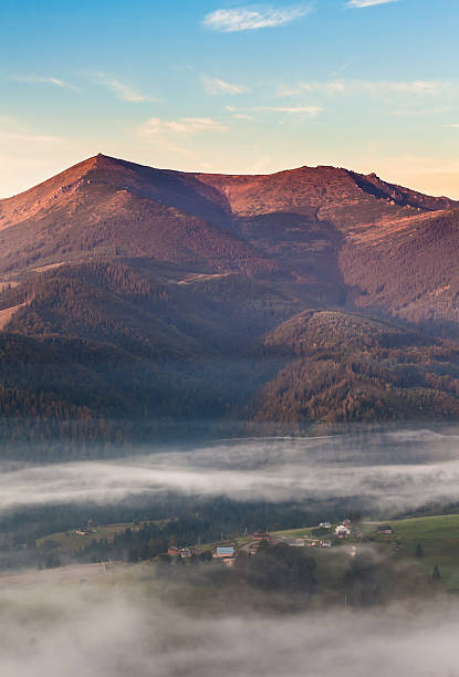 istock fog and cloud mountain valley landscape 518895533