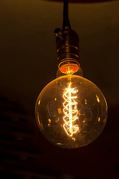 istock single glowing round bulb tungsten lamp 518895573