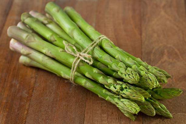 istock asparagus on the brown old table 518895583