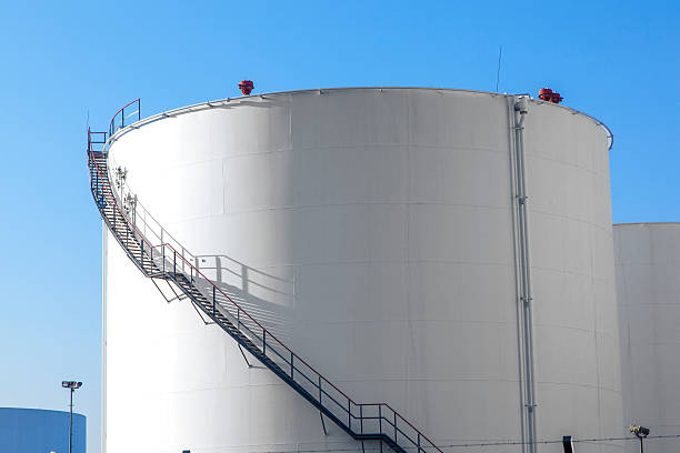 istock white tank in tank farm with blue sky 518896141