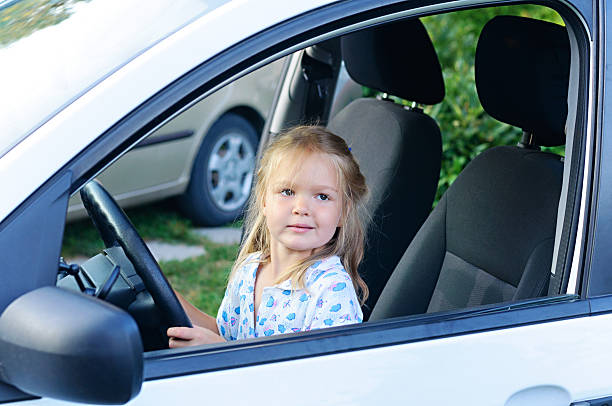 istock Little girl sitting in car. 518896441