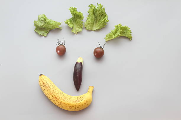istock Vegetables are placed into the man's smile 518897543