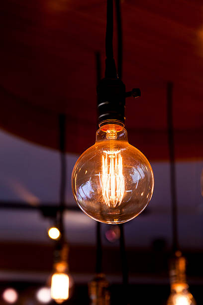 istock glowing round bulb tungsten lamp 518897739