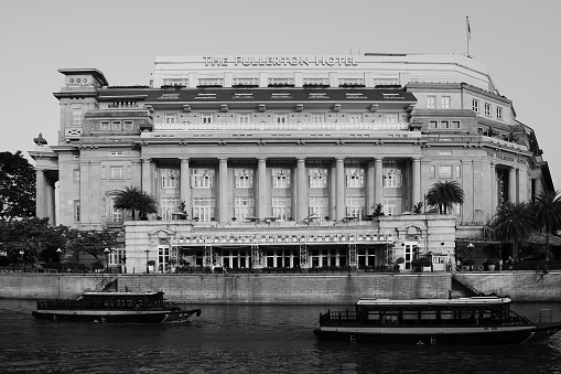 Singapore, Singapore - March 30, 2016: The Fullerton Hotel is a five-star luxury hotel located near the mouth of the Singapore River in Singapore.