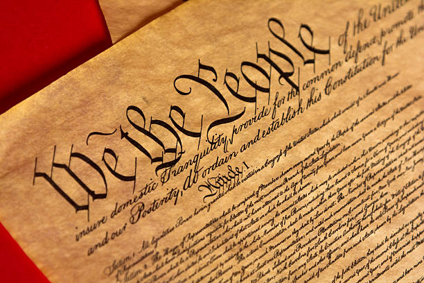 istock Parchment of the Constitution with a red background 518899548