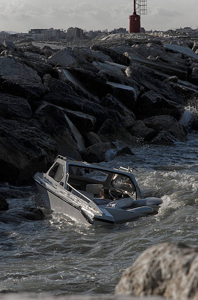 istock Boat sinking in front of the port 518899602
