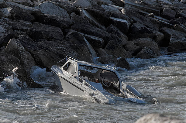Sinking boat in front of the port