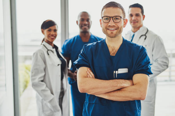 istock Confident doctor in front of group 518899958
