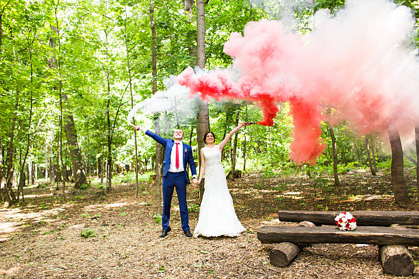 istock The bride and groom  with   smoke bombs on the background 518900806