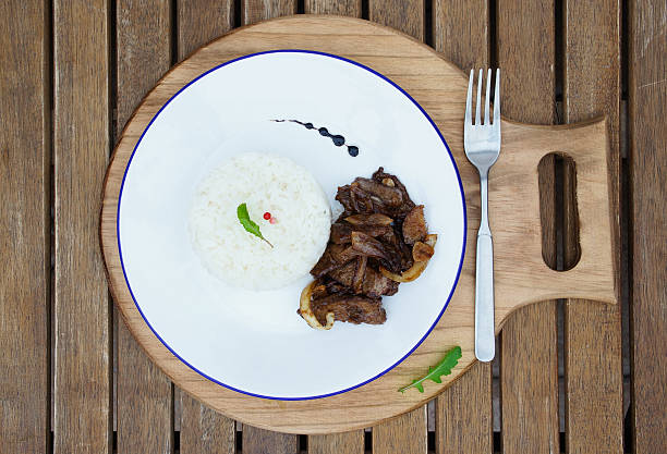 beef in spicy sauce and rice with celeriac and ginger