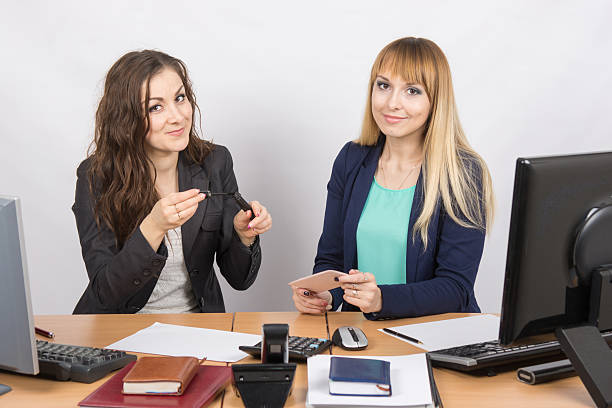 istock Office worker shows a colleague mascara at your desk 518900974