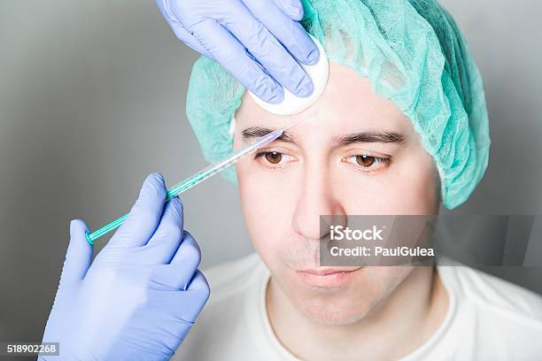 Doctor Aesthetician Makes Face Beauty Injections To Male Patient Stock Photo - Download Image Now