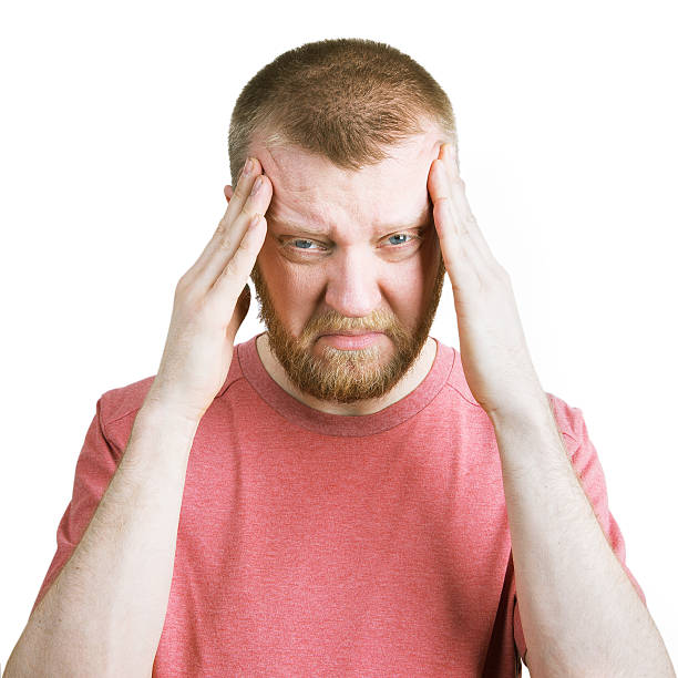 istock Bearded man holds on to his head 518904760