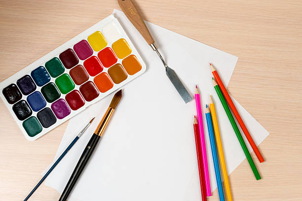 istock paints and pencils for drawing are around a blank slate 518907840