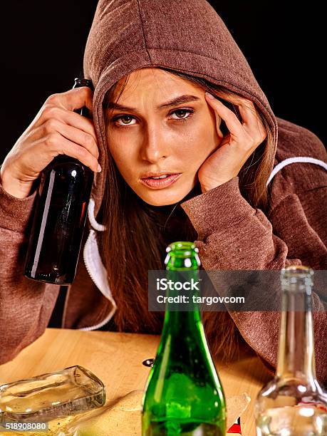 Drunk Girl Holding Green Glass Bottle Of Vodka Stock Photo - Download Image Now - 20-29 Years, Addict, Addiction