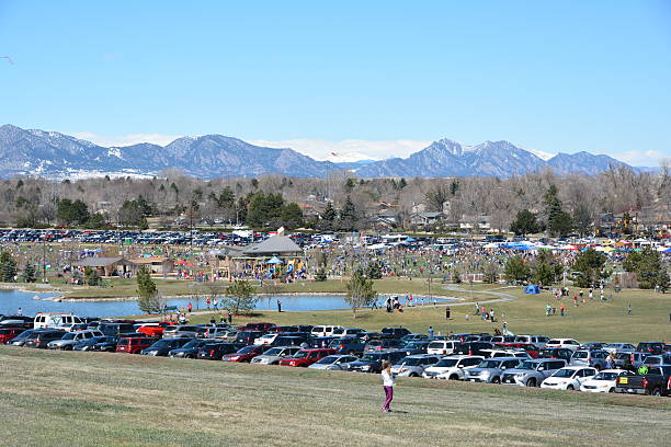 Arvada Kite Festival Arvada, CO, USA - April 3, 2016: Arvada Kite Festival. The Arvada Kiet Festival not only includes plenty of kite-flying but also kid-oriented activities like jumping castles, face painters, hamster balls and more. There is also live music and booths offering everything from handmade crafts to food. It's a great family oriented family festival.  arcada stock pictures, royalty-free photos & images