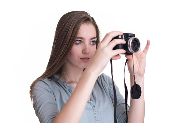 istock Happy young girl making photo with camera 518908494