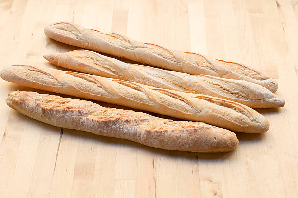 fresca francés baguettes - bread food french currency freshness fotografías e imágenes de stock
