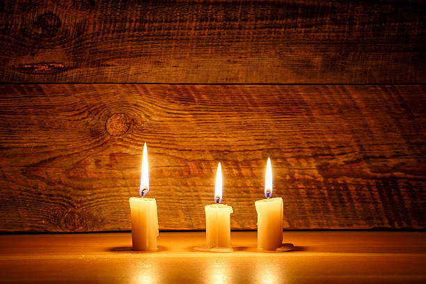 istock Background with candle light on wooden board at the night 518909212