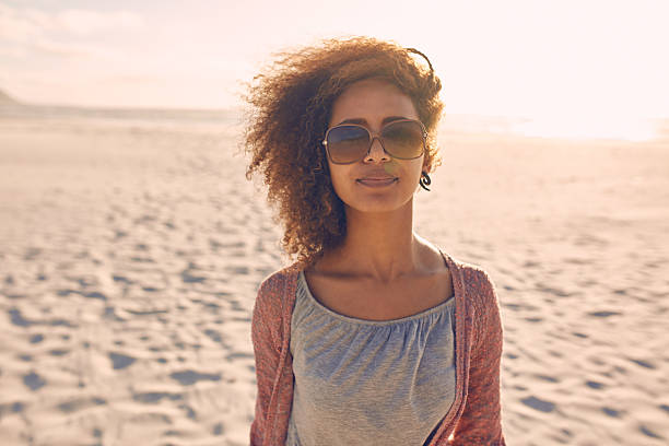 istock Attractive young woman standing on a beach 518910202