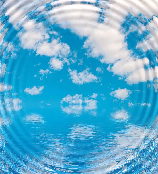 Photo of Surface Rippled of water with clouds and sky background