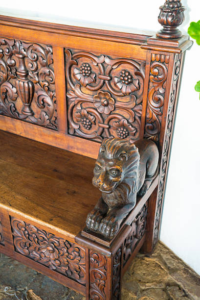 Decorative armrest of an old colonial bench