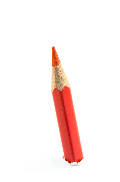istock red pencil close up on white background 518910461