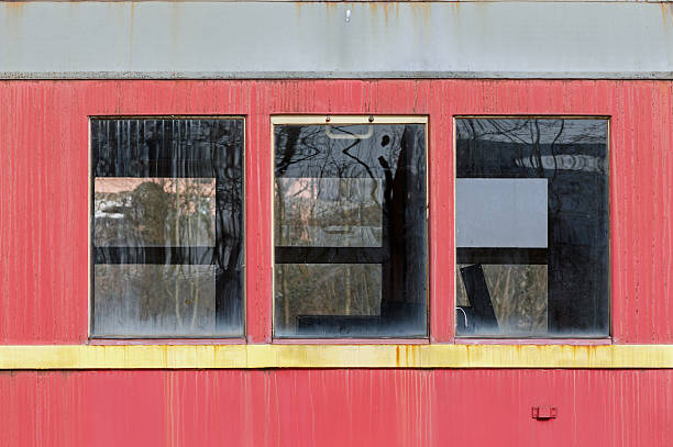 istock Windows of an old rusty obsolete german train waggon 518911558