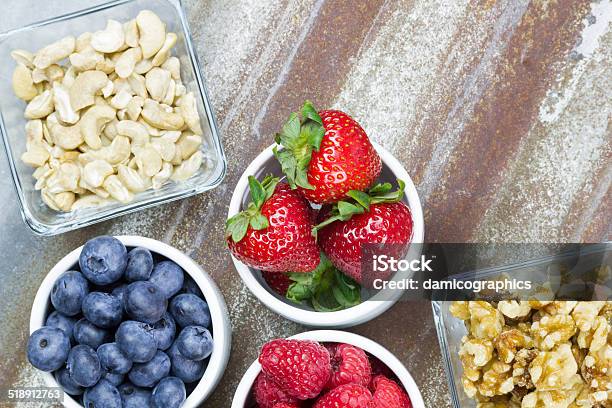 Healthy Snack Foods Of Berries And Nuts Stock Photo - Download Image Now - Antioxidant, Backgrounds, Berry Fruit