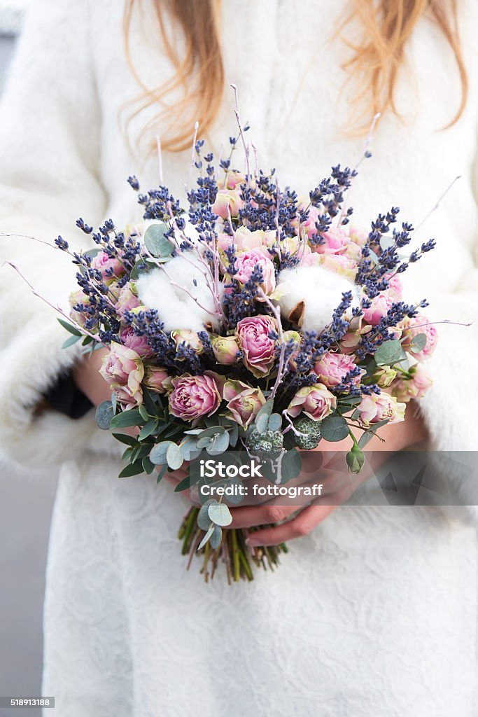 Bride with wedding bouquet Bride with wedding bouquet in her hands. Closeup Arrangement Stock Photo
