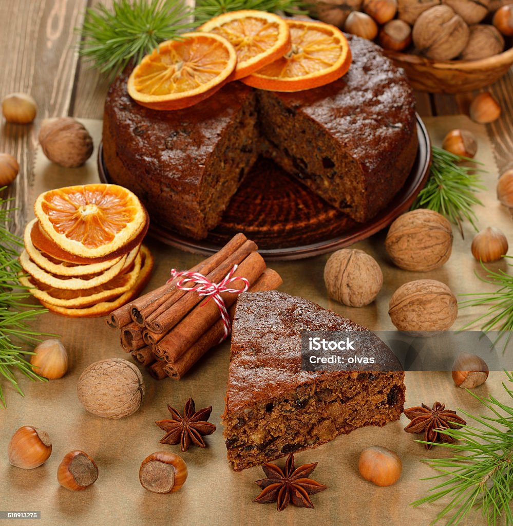 Christmas fruit cake Christmas fruit cake on brown background Anise Stock Photo