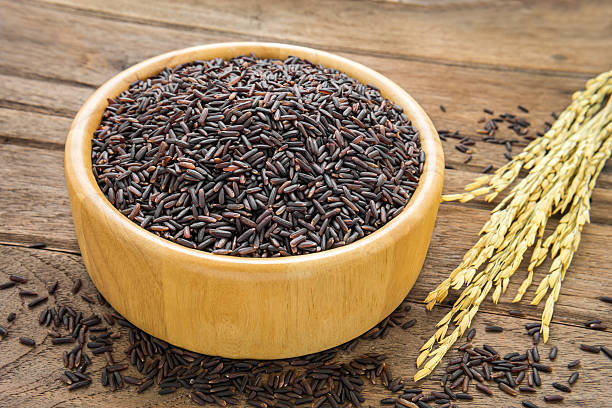 istock Black rice in bowl on wooden table 518913509