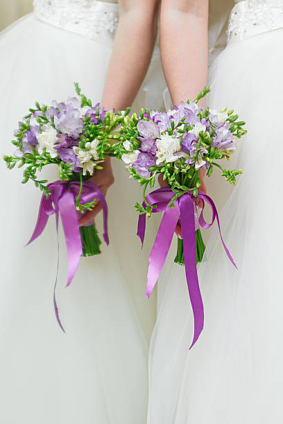 istock Wedding bunch of flowers in hands  the bride 518916931