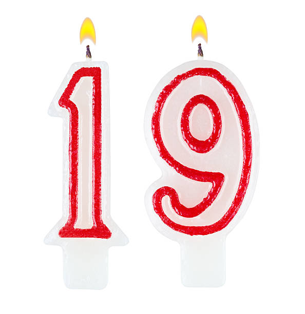 istock Birthday candles number nineteen isolated on white background 518917827