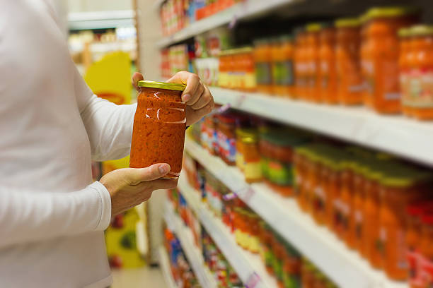 istock Man Holding jar of chutney 518925945