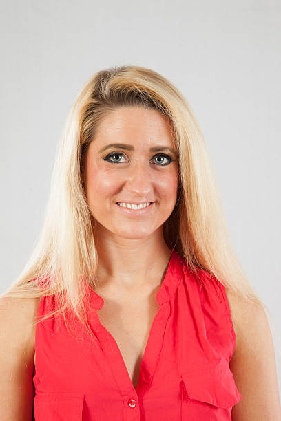 istock Blond woman smiling at the camera 518926465